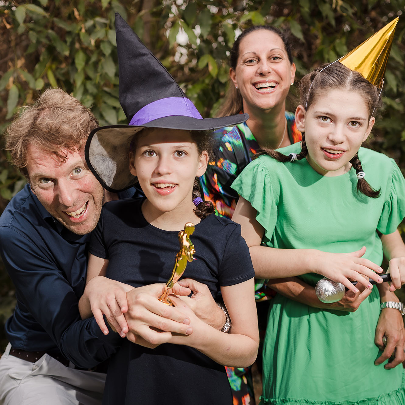 Photo of a family taking a party photo